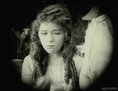 Black And White Woman Making Funny Face With Eyes Closed GIF