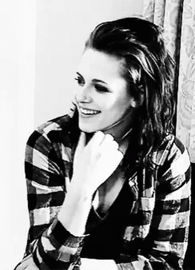 Black And White Woman Smiling In Plaid Shirt GIF