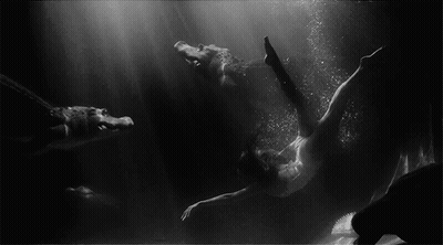 Black And White Woman Swimming In Water GIF