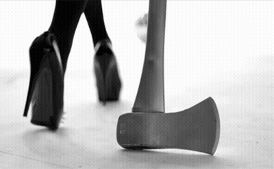 Black And White Woman Walking Next To Axe GIF
