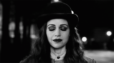 Black And White Woman With Bowler Hat And Glowing Eyes GIF