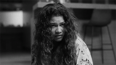 Black And White Woman With Curly Hair Making Sad Face GIF