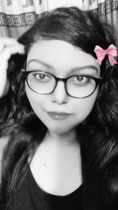 Black And White Woman With Glasses And Pink Bow GIF