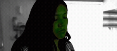 Black And White Woman With Green Face Paint GIF