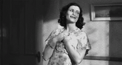 Black And White Woman With Hands On Chest GIF