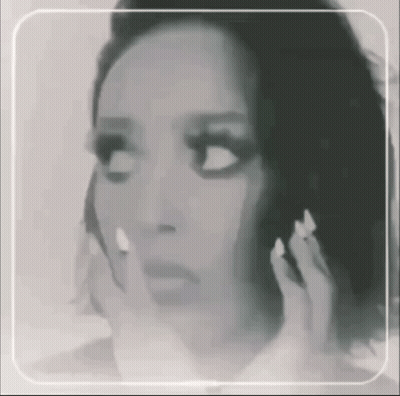 Black and White Woman With Hands on Face