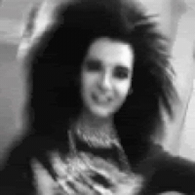 Black And White Woman With Long Hair Smiling At Camera GIF