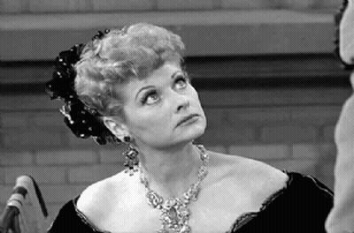 Black And White Woman With Necklace Looking Up GIF