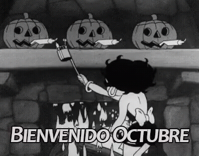 Black And White Woman With Pumpkins By Fireplace GIF