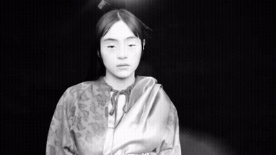Black And White Young Girl In Kimono Looking At Camera GIF