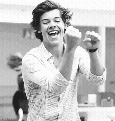 Black And White Young Man Laughing With Fist Up GIF