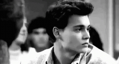 Black And White Young Man With Ponytail GIF