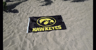 Black And Yellow Hawkeyes Flag In Sand GIF