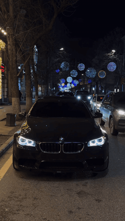 Black BMW Parked On Side Of Road GIF