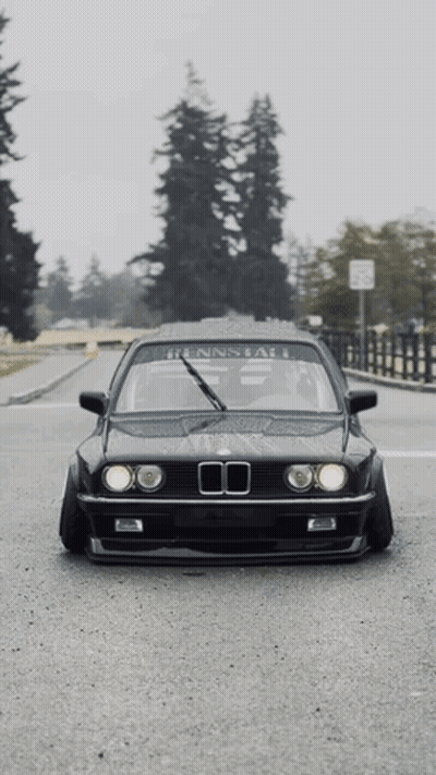 Black BMW Parked On Street GIF
