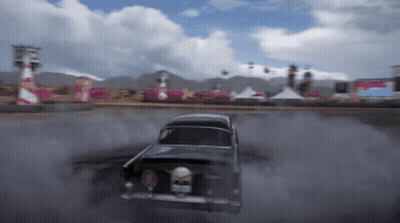 Black Car Drifting On Track With Smoke GIF