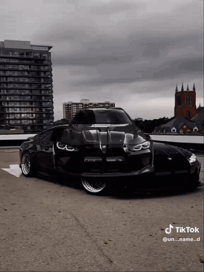 Black Car Parked In Parking Lot GIF