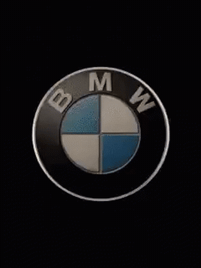 Black Car Silhouetted Against Spotlight GIF