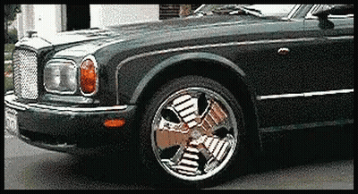 Black Car With Fan Shaped Wheel GIF
