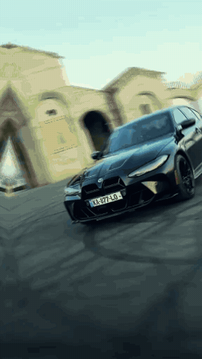 Black Car With License Plate KA-977-LO Driving Down Street GIF