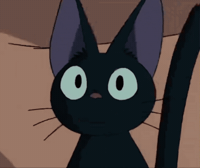 Black Cat With Green Eyes And Purple Ears GIF