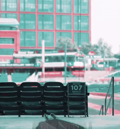 Black Chairs With 107 Sign GIF