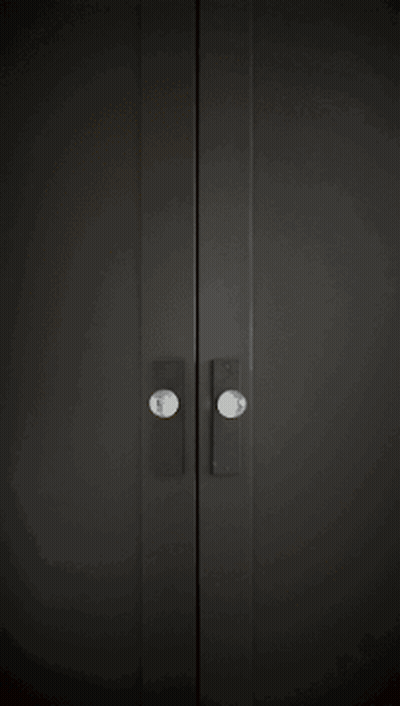 Black Door With White Sign Saying Mo GIF