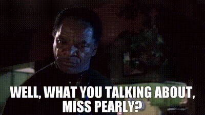 Black Dress Woman Talking On Green Couch GIF