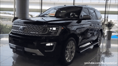 Black Ford Expedition Parked In Showroom GIF