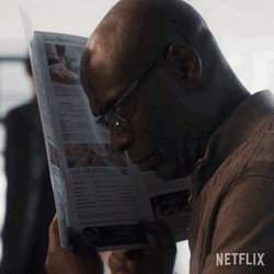 Black Guy Behind Newspaper Hiding Meme GIF