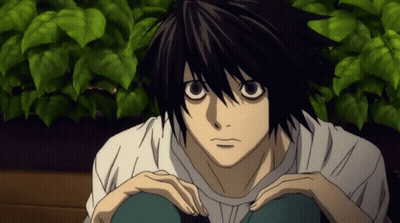 Black Haired Anime Character In White Shirt Sitting GIF