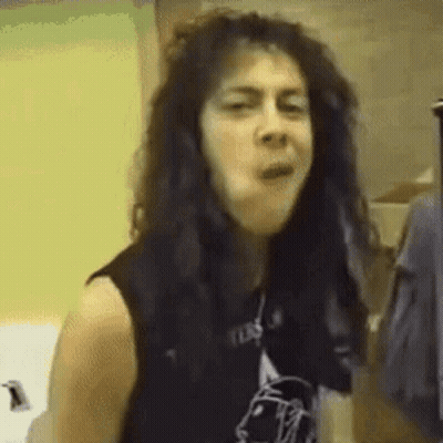 Black Haired Woman Making Funny Face Black Vest GIF