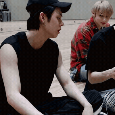 Black Hat Man Beside Red Plaid Man GIF