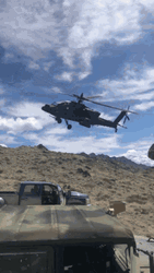 Black Helicopter Flying Fast Sideways GIF