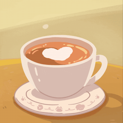 Black Kitten Sitting Next To Cup Of Coffee GIF