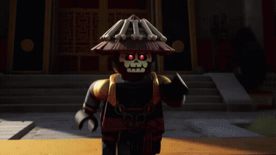 Black Lego Figure With Straw Hat In Front Of Building GIF