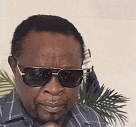 Black Man Glasses Off Squinting GIF