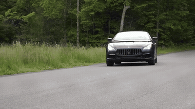 Black Maserati Driving Down Road GIF