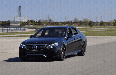Black Mercedes Driving Past Emerson Building GIF