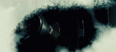 Black Object Surrounded By White Smoke GIF