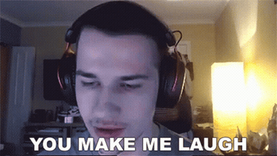 Black Shirt Man Sitting At Sign Please Allow Our Staff To Restroom GIF