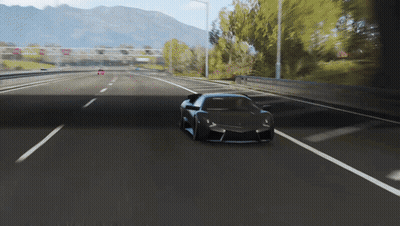 Black Sports Car Driving Down Highway With Mountains GIF