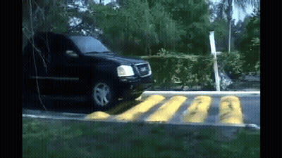 Black SUV Driving Over Yellow Line GIF