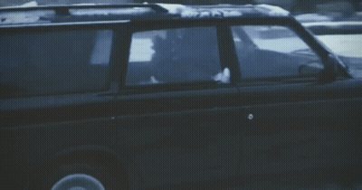 Black SUV Driving Through Snow GIF