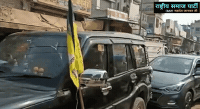 Black SUV With Yellow Flag Parked On Street GIF