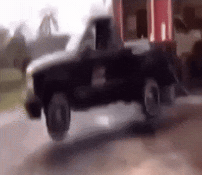 Black Toy Truck Driving Down Road GIF