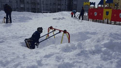 Blizzard Aftermath  Kid Playing In Swing  GIF