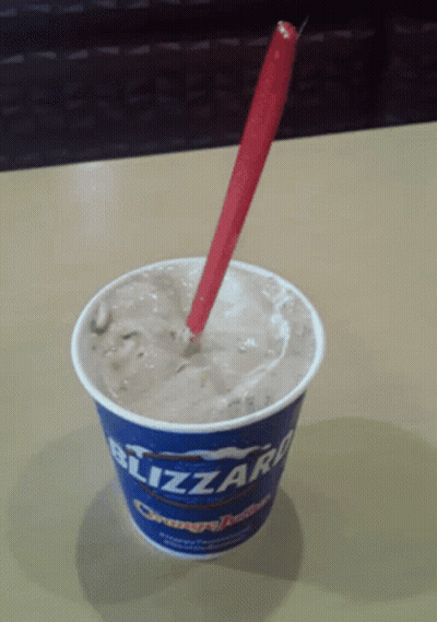 Blizzard Ice Cream Cup With Red Spoon GIF