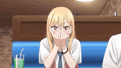 Blonde Anime Girl Covering Face In Diner GIF