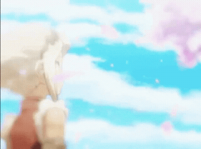 Blonde Girl Holding Flower In Front Of Cherry Blossom Tree GIF